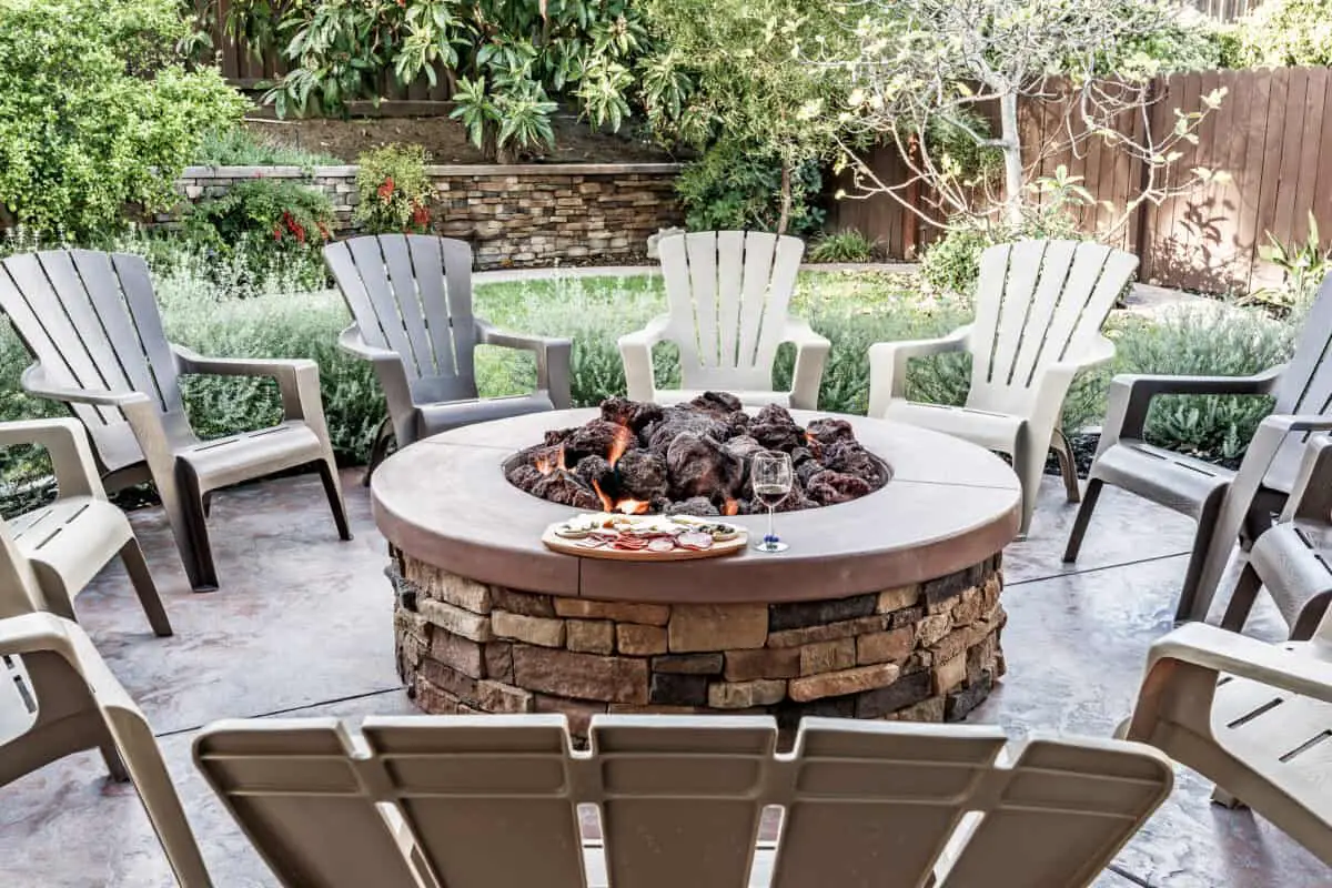 A gas fire pit using appropriate rocks and not wood in a gas fire pit. 