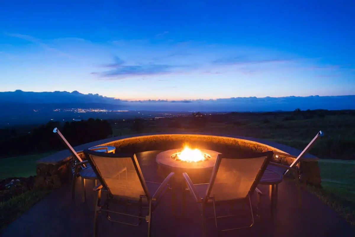 Back yard chairs with fire pit at sunset