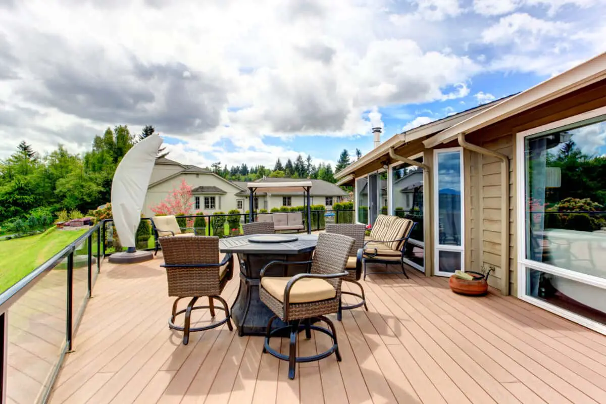 Screened walkout deck with fire pit, chais, bench and garden swing