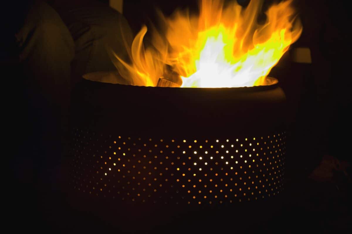 fire pit with air holes burning wood