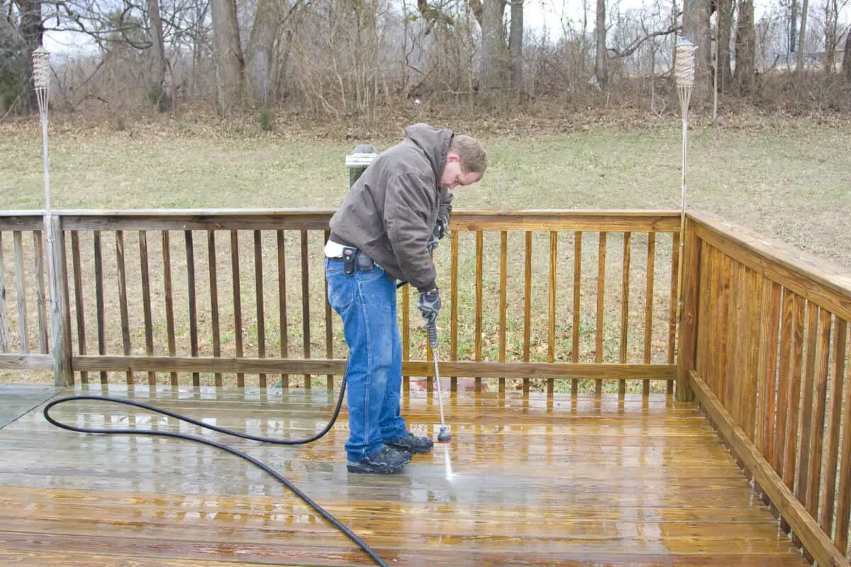 Male demonstrated pressure washer deck cleaning on rear deck.