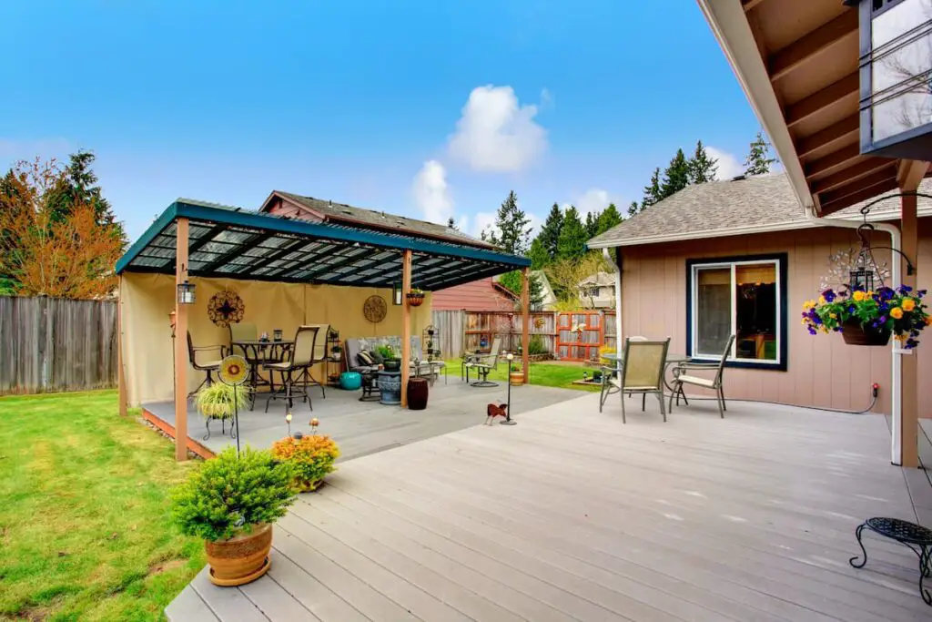 Backyard walkout deck getting optimal shade from a pergola.