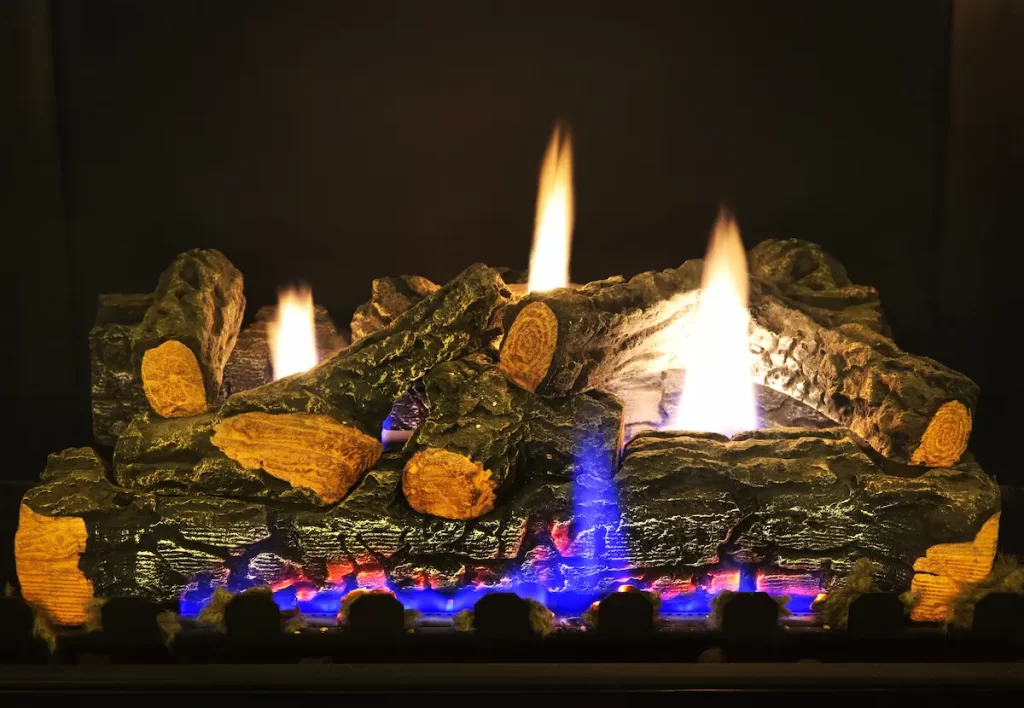 Ceramic logs on a fireplace showing an example of the heating power of gel-fueled fireplaces.