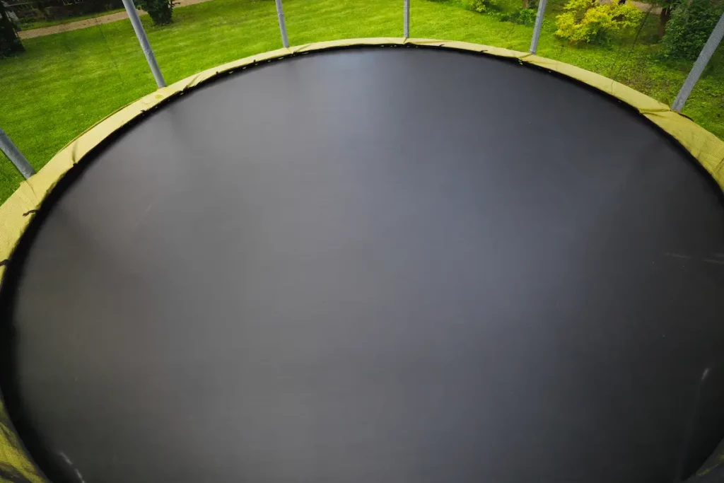 close up of black trampoline mat