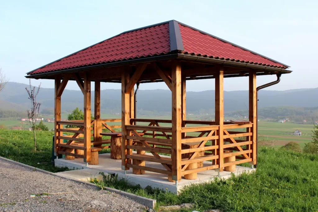 wooden gazebo installed on concrete pad