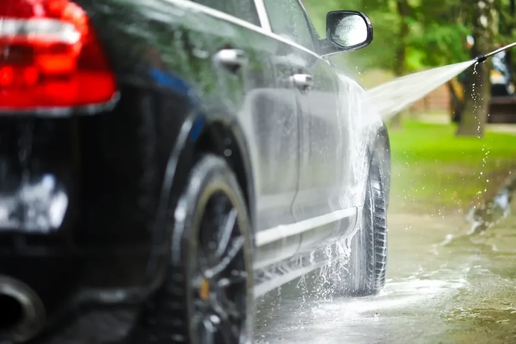 pressure washing a car close up