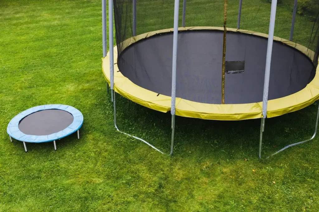 small trampoline next to large