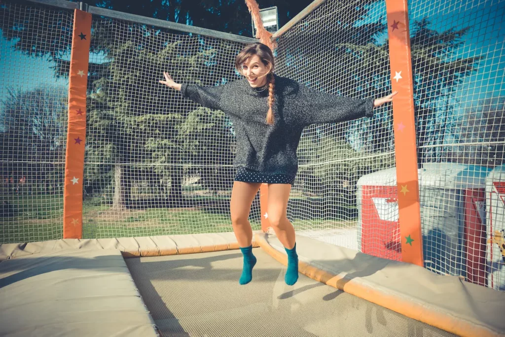 woman jumping on trampoline to try and induce labor