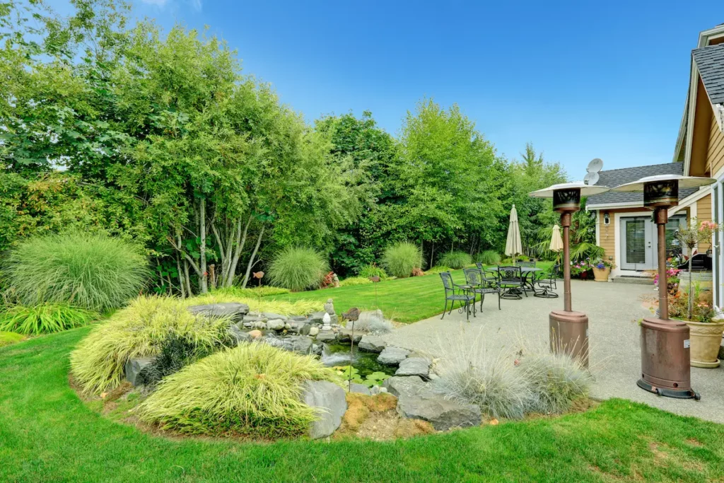 A backyard with two propane patio heaters that can be converted from propane heater to natural gas.