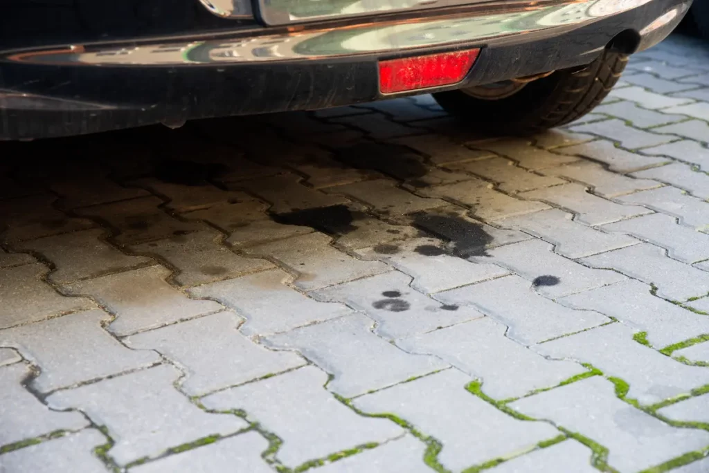 driveway with oil stain from car exhaust